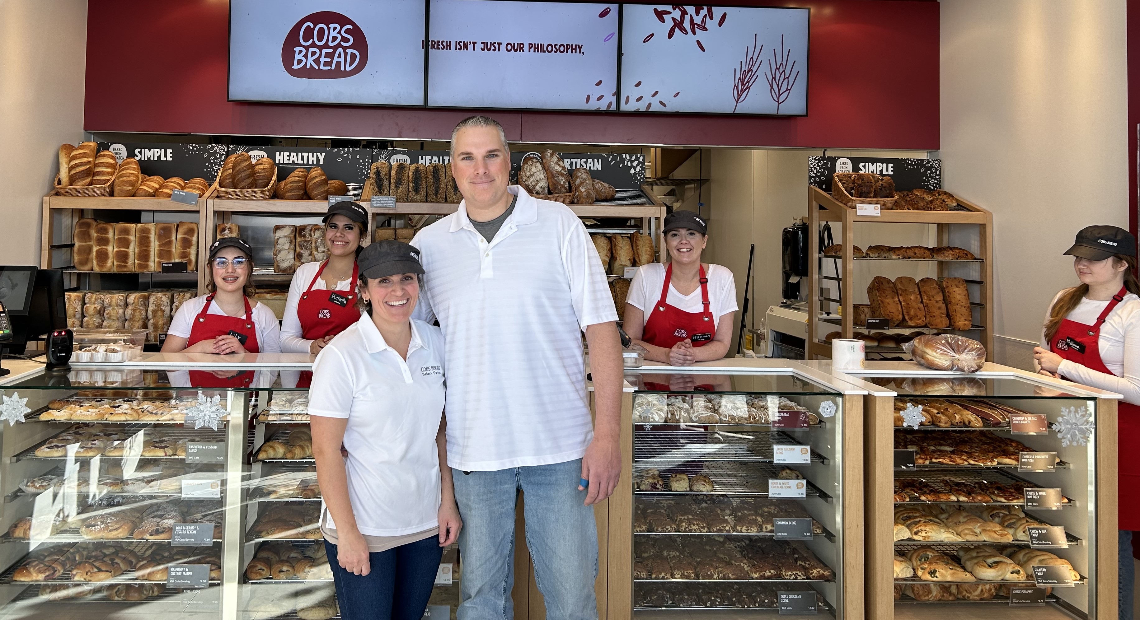 Owner Mary Deltin her husband and team at Cobs Bread