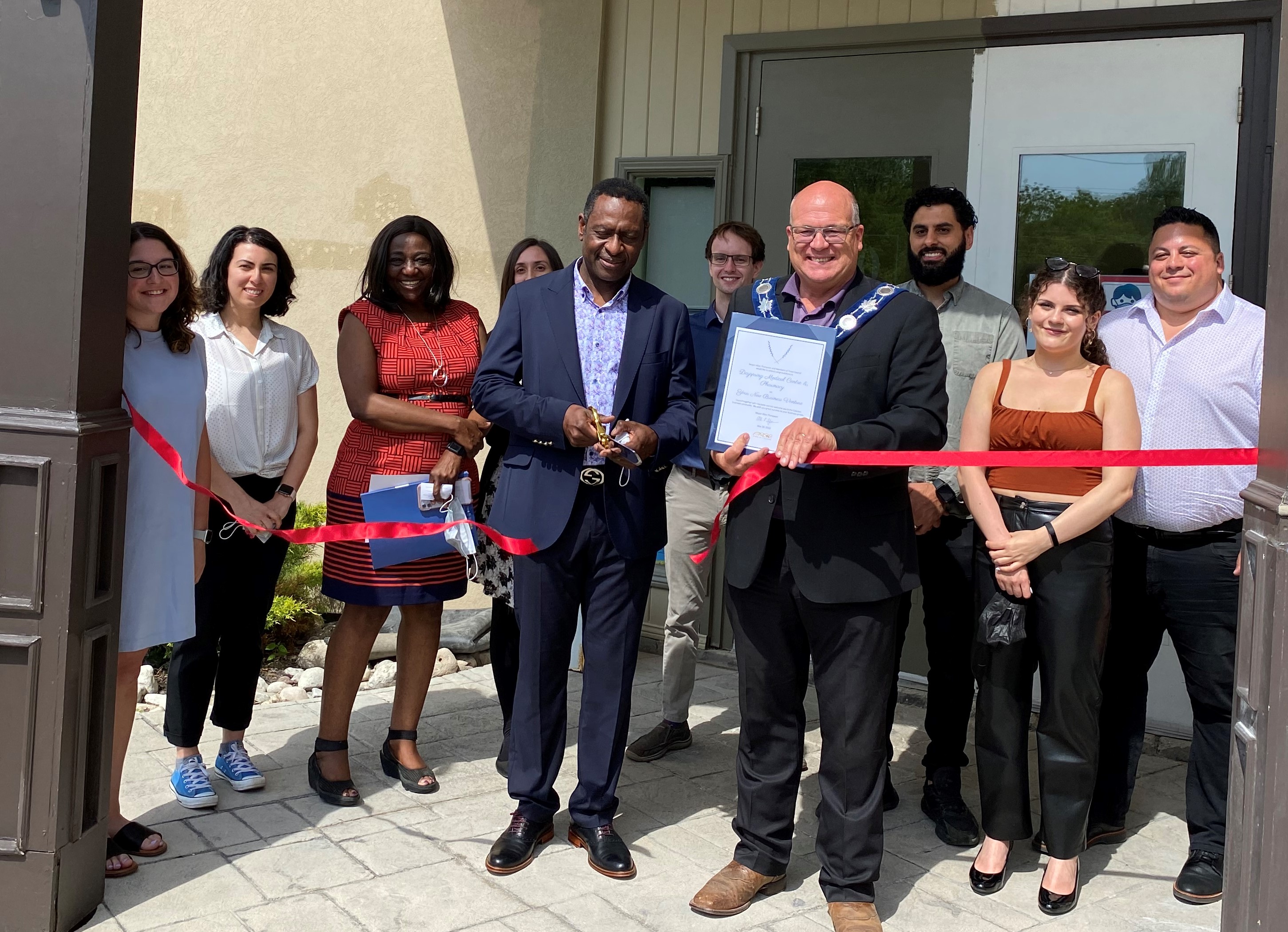 Dayspring Medical Centre and Pharmacy team ribbon cutting with Mayor Allan Thompson