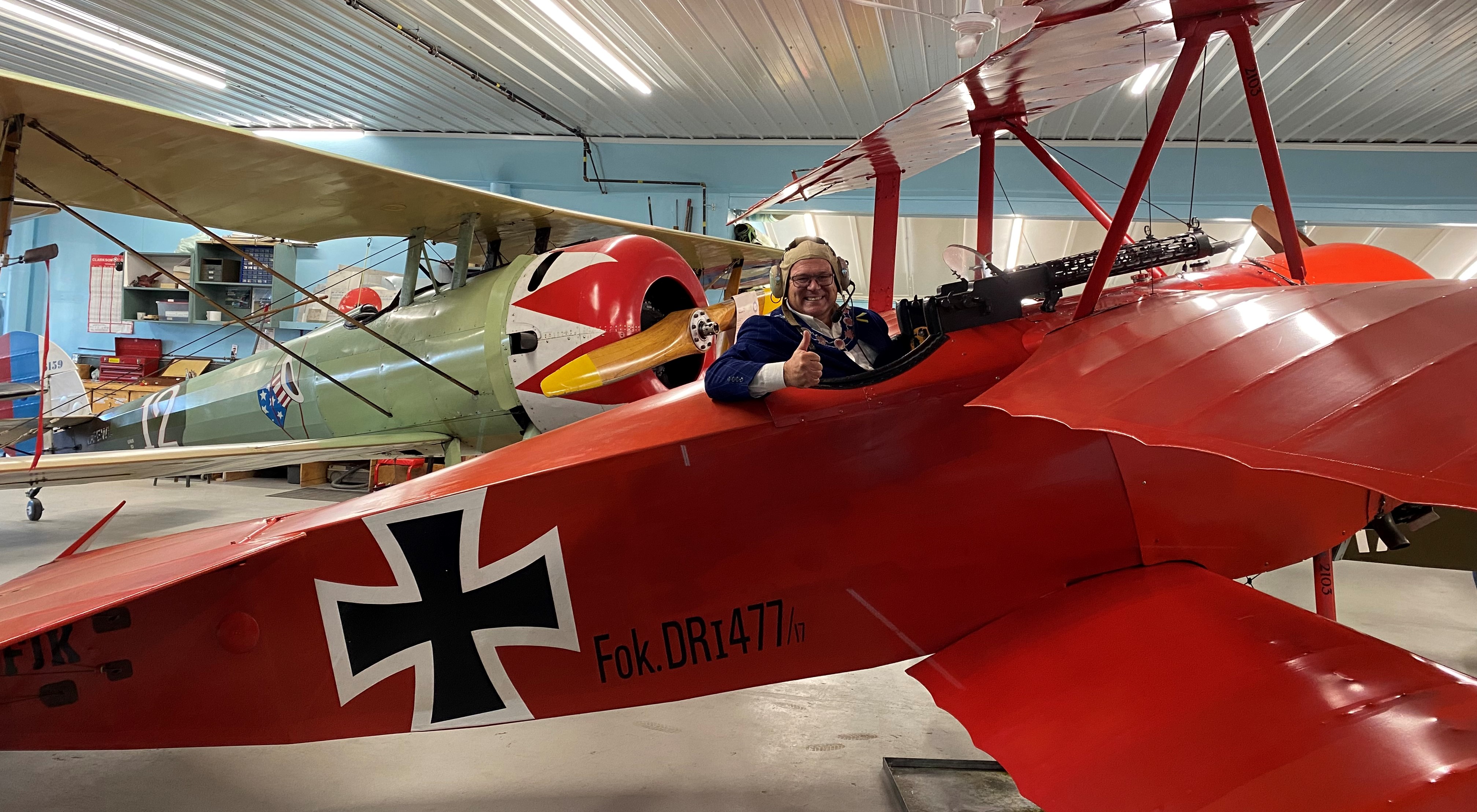 Mayor Thompson sitting in replica plane