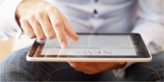 Man reading news on a tablet